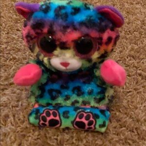 A stuffed animal phone holder